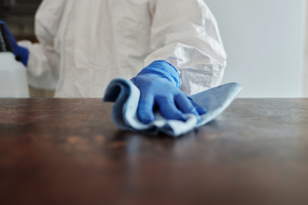 pexels-photo-4099467 Close-Up Photo Of Person Cleaning The Table